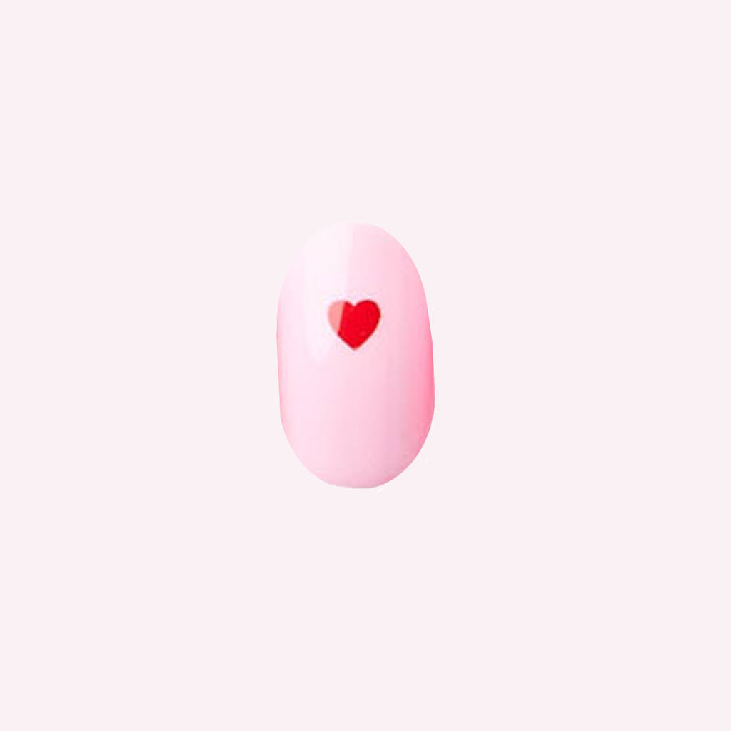 Pink Perfect Heart - Press-On | Round | Short with soft pink base and single red heart nail design for quick at-home mani.