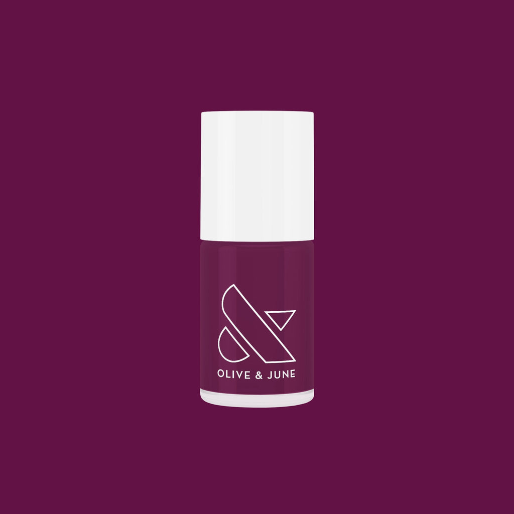 Olive and June Plaza nail polish bottle in deep mulberry purple shade for long-lasting gel manicure
